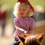 Child Riding at A Bar A Ranch
