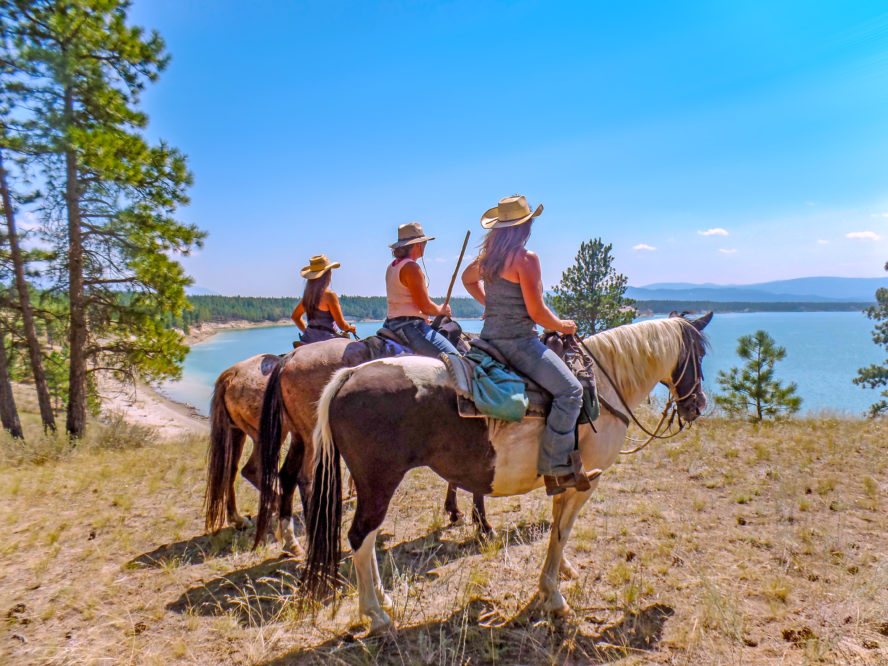 3 riders looking out over water