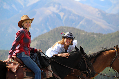 JJJ Wilderness Ranch two cowgirls on horses