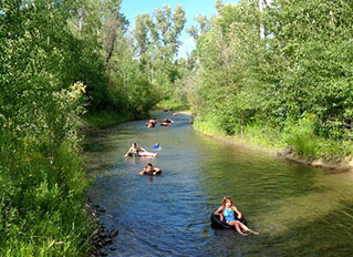 R Lazy S Ranch kids tubing down creek
