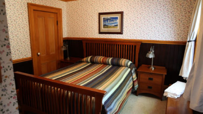 bed and side table in cabin