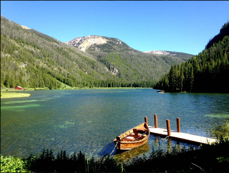 Boat in lake at Flat Creek Ranch