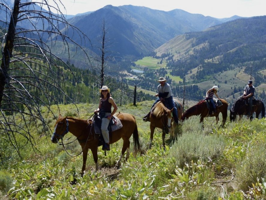 trail ride with horses and mountains