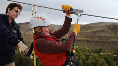 Guest on a zipline at Bar Lazy J Ranch