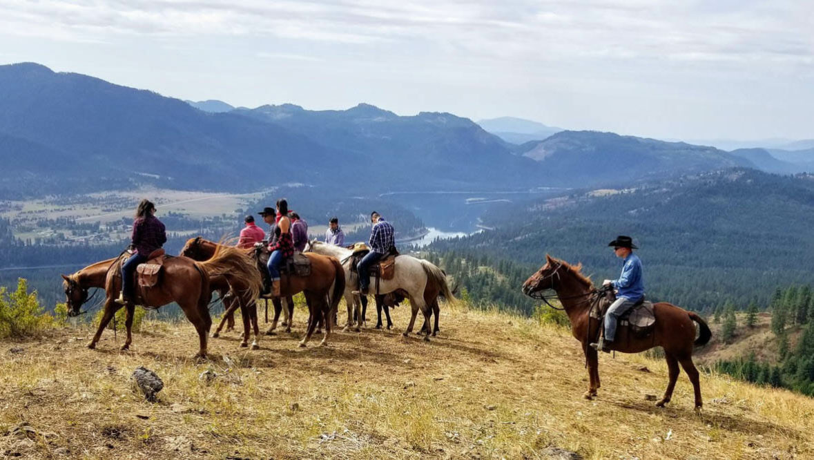 Horses and riders looking out at the view at Bull Hill Ranch