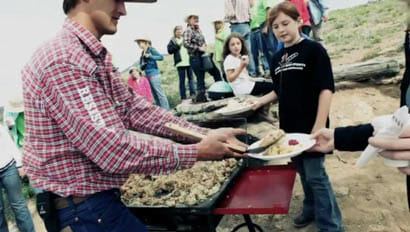 Staff serving a guest dinner at Drowsy Water Ranch