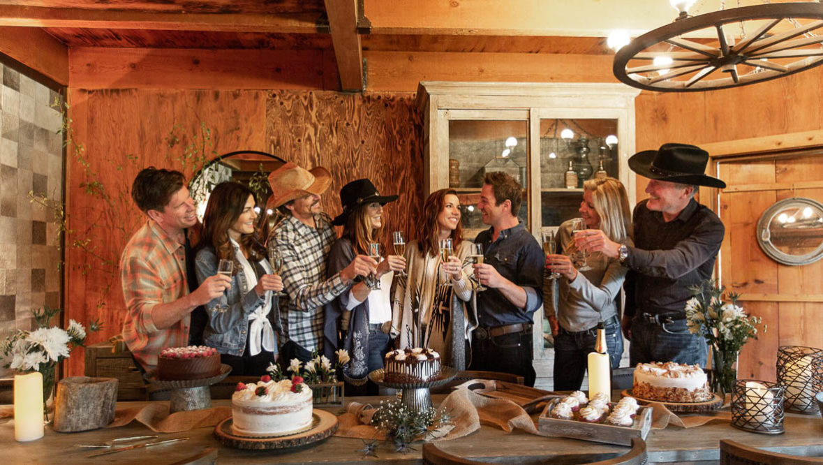 Family cheers in lodge kitchen at Greenhorn Ranch