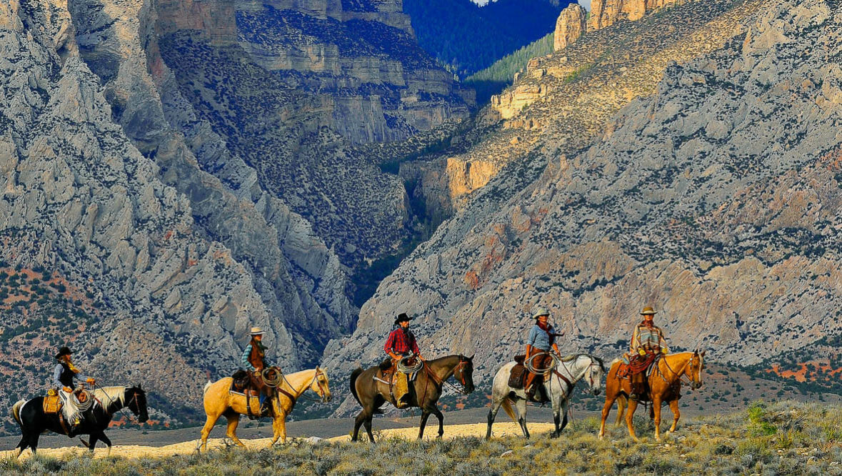 Trail ride at sunset at Hideout Lodge Ranch