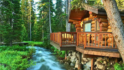 Lodge by a creek at Lone Mountain Ranch