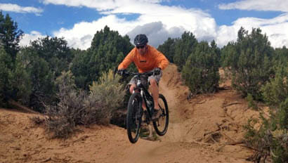 Guest mountain biking at Majestic Dude Ranch