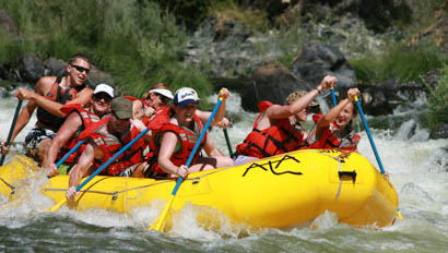 Group of guests white water rafting at Marble Mountain Ranch