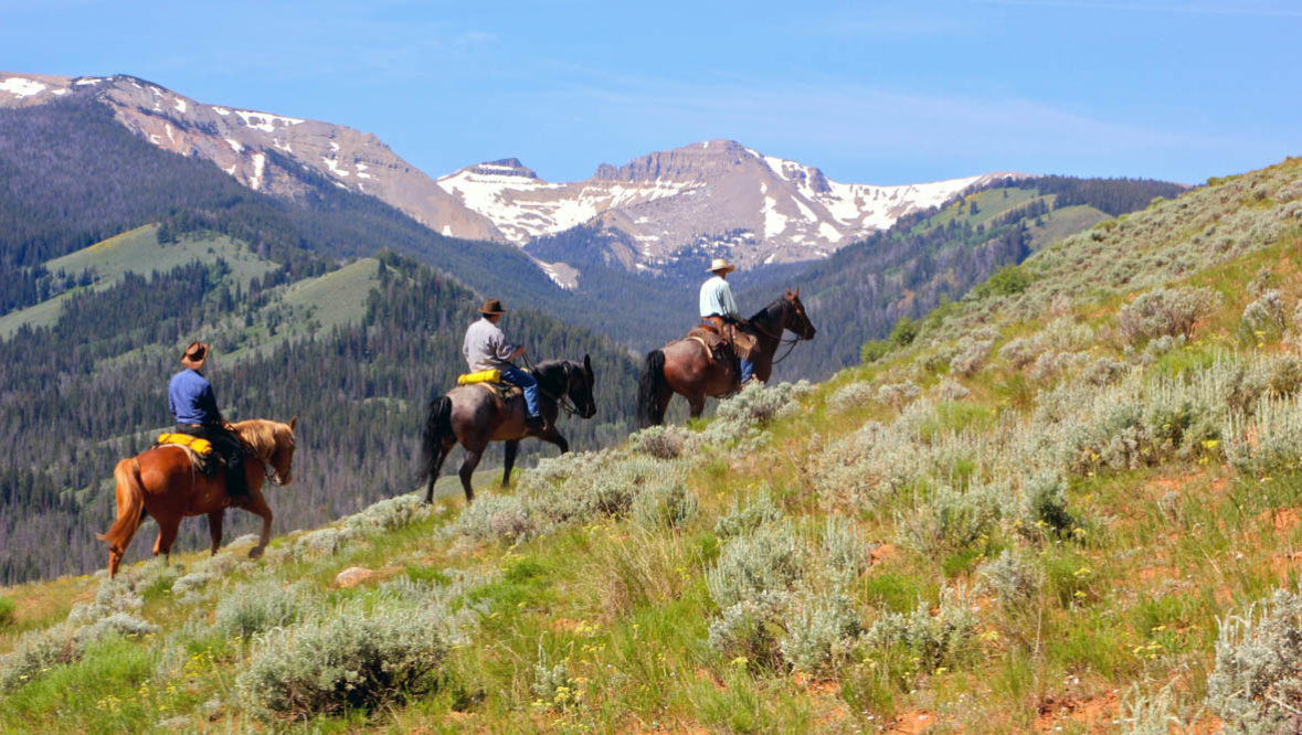 Three riders on a trail at Red Rock Ranch