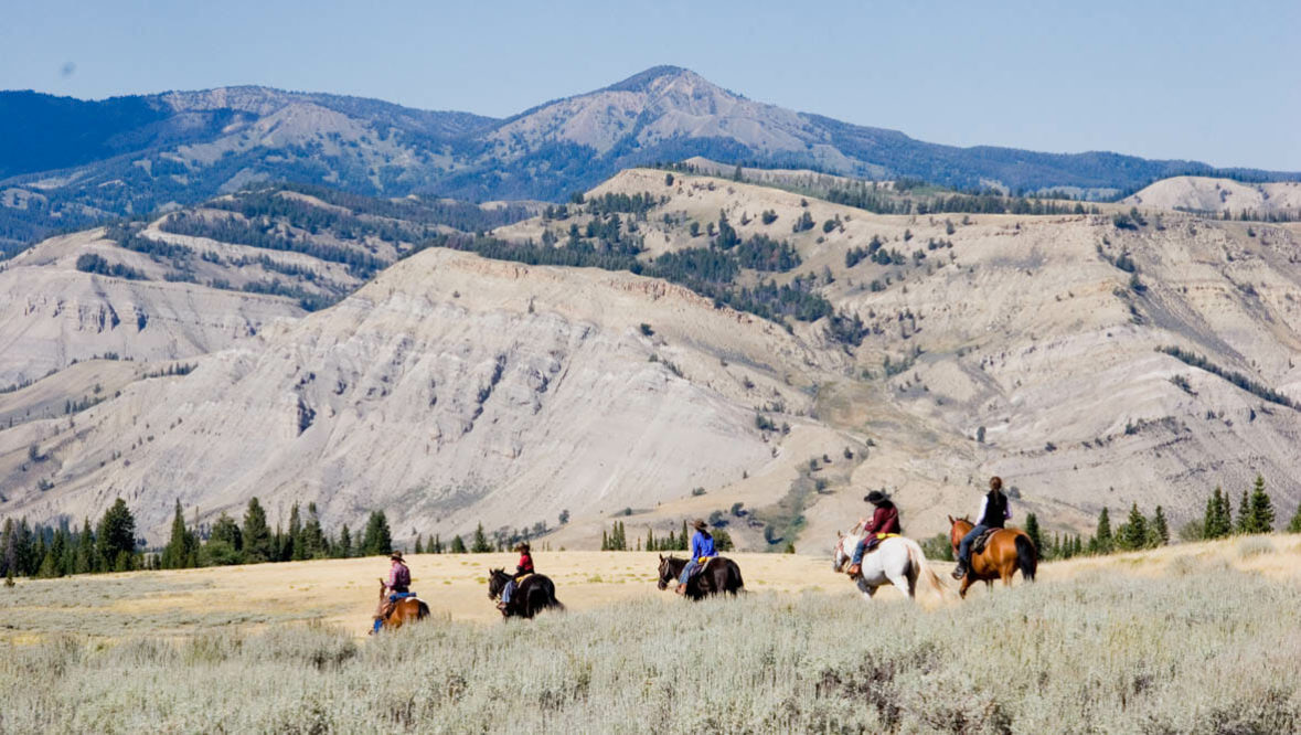 Red Rock Ranch trail ride with mountains in the background