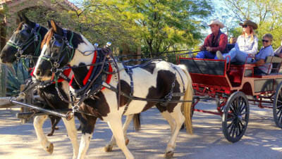 People in a horse drawn wagon at Stagecoach Trails Guest Ranch