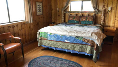 Cabin bedroom at Triangle X Ranch
