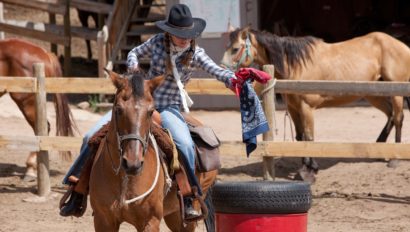 cowgirl getting riding lessons