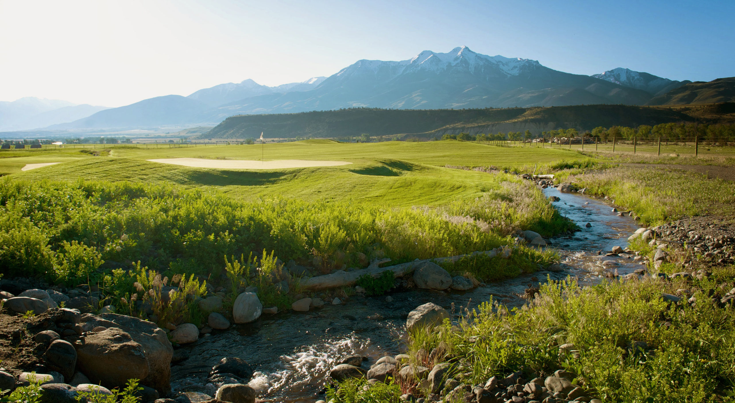 golf course with stream running through