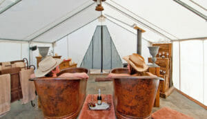 people in tubs in a tent