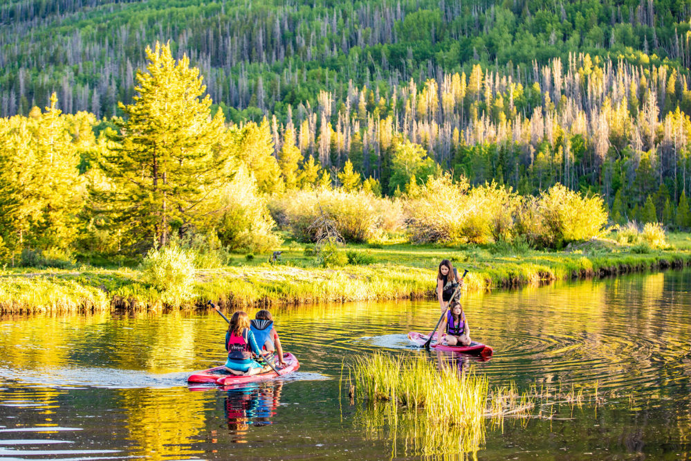 Rawah Ranch kids paddleboarding