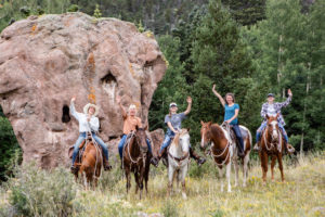 group of people on horseback
