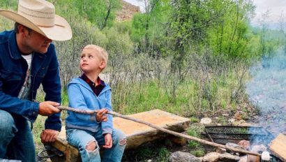 father and child at bonfire